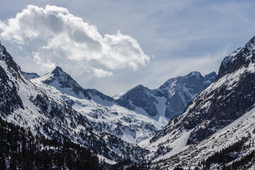 Frozen Gaube Lake (Lac de Gaube) in the French Pyrenees, in the department of the Hautes-Pyrénées, near the town of Cauterets, France. The Mount Vignemale in the background.