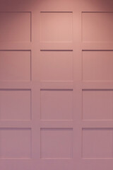 design pink wall with wooden squares, close-up, copy space