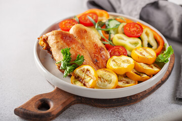 Diet lunch - chicken breast with zucchini grill and fresh vegetables. Top view