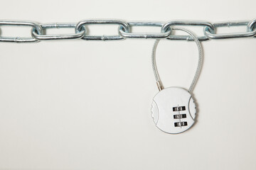 Cipher padlock on chain on white background. Security concept.