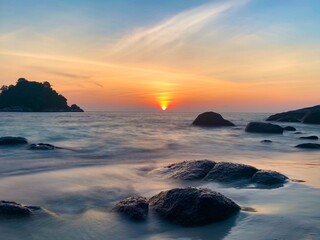 Fototapeta na wymiar Dramatic sunset over the sea, long exposure.