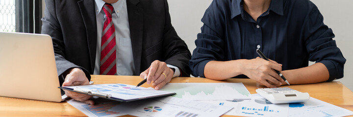 business professionals sitting around table meeting colleagues working together brainstorming on project discussing and planning concept at office