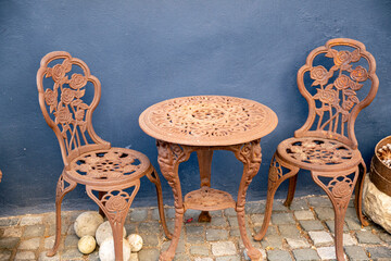 Chair and table in rusty iron for the garden