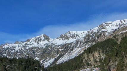Obraz premium Peaceful nature view of Gaube Valley with amazing snow-capped mountain range background in the French Pyrenees, in the department of the Hautes-Pyrénées, near the town of Cauterets, France.
