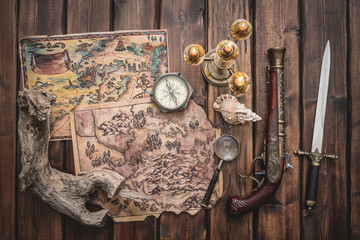 Pirate treasure map on the old wooden table concept background.