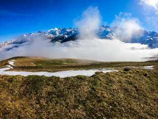 Snow and mountain peaks in the french Pyrenees near the Luchon Superbagnères Ski Resort in the Arrondissement of Saint-Gaudens, Occitania, Haute-Garonne, France. The Luchonnais Mountains aerial view.