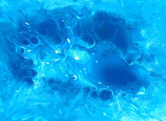 Abstract fluid art background. Blue, cyan and white colors mix together. Beautiful creative print. Abstract art hand paint. Original artwork. Color splashing on paper. Cosmic texture