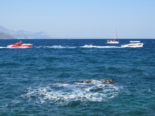 Fototapeta premium Boat on Turkish Mediterranean seaside landscape with mountains.
