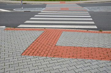 navigation tactile tiles strip for blind and disabled pedestrians who have vision problems. The red...