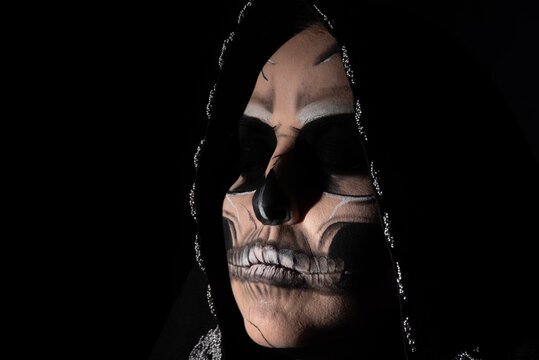 The death. Artistic makeup representing death, Low Key image, selective focus.