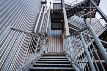 Galvanized steel stairs with slatted floor in an industrial area, the Netherlands