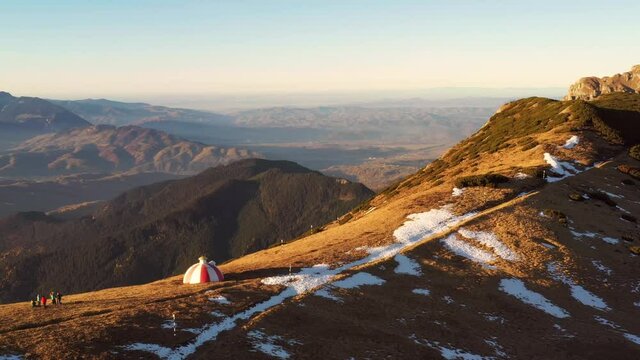 Drone 4k clip of Batrana mountain refuge high at 2170m in Bucegi Mountains, Romania, on a beautiful autumn day	