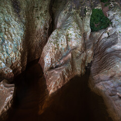 Inside Moria Gate Arch. The Oparara River flows through it making these formations in the rock. Kahurangi National Park, South Island, New Zealand.