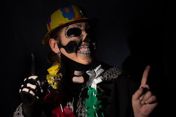 The death. Artistic makeup representing death in a carnival costume play, Low Key image, selective...