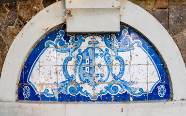 Traditional decoration of the facade of the house in Porto. Typical Portuguese and Spanish tiles azulejos