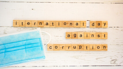 International Day Against Corruption.words from wooden cubes with letters photo