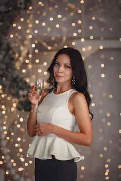 Charming happy young woman in a festive evening dress