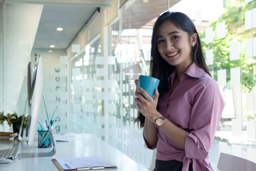 Cropped shot of two UI developers meeting on their project with paperwork and tablet on meeting...