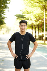 A young man walks outdoor as workout
