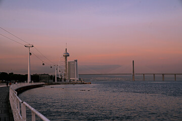 Fototapeta na wymiar Sunset in Lisbon, Portugal overlooking Vasco Da Gama Bridge,
