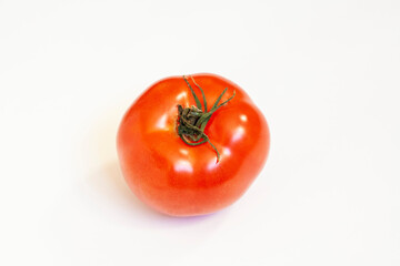 Ripe fresh red tomato isolated on a white background