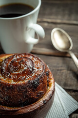 Morning still life of hot fresh home baked buns and coffee