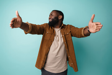 Displeased african american man stretching his hands for hug