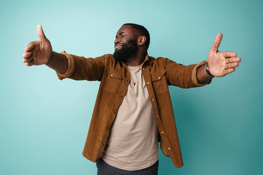 Displeased African American Man Stretching His Hands For Hug