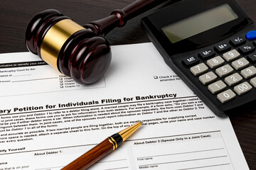Bankruptcy petition for individuals with calculator and gavel. Concept of financial and...
