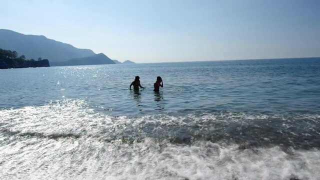 Children swim in the sea. Turkish Riviera Mediterranean coast of Antalya Province in Turkey.