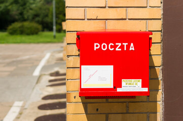 POZNAN, POLAND - Aug 07, 2017: Red mail box on a wall