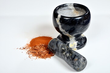 Catuaba bark and catuaba powder on white background. Natural herbal tea from Catuaba tree bark, natural aphrodisiac from Brasilia