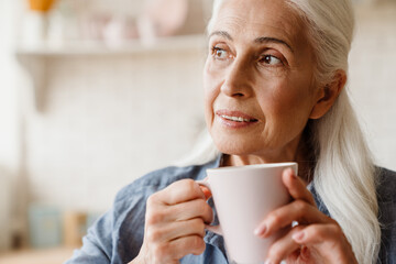 Senior woman holding a cup of coffee