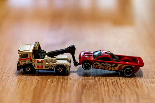 POZNAN, POLAND - Oct 13, 2020: Matchbox tow truck pulling a vehicle