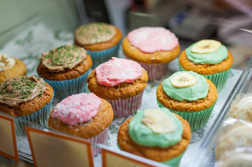 Multi coloured cupcakes for sale and on display