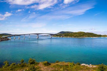 Fototapeta na wymiar Bridge over vivid blue ocean in Northern Norway