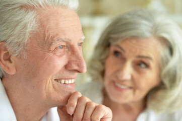 Close-up portrait of happy senior couple posing