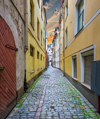 Morning in narrow medieval street of old city of Riga, Latvia, Europe. 