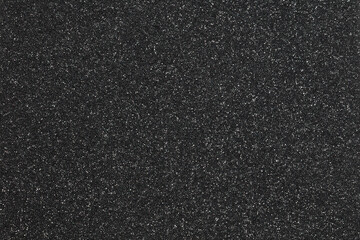 Texture of black foam rubber and background, close-up.
