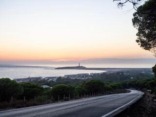 puesta de sol del faro de trafalgar en caños de meca cadiz