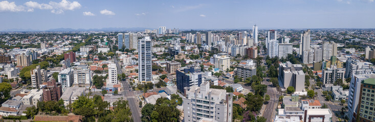 Fototapeta na wymiar Drone image taken which shows a panoramic view of the Alto da XV neighborhood in Curitiba, capital of the state of Paraná, Brazil, with its buildings and trees
