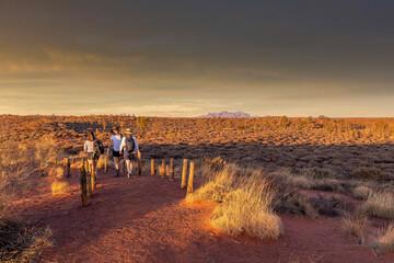 Northern Territory, Australia - Hikers in the Australian outback admiring the spectacular...