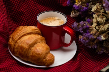 french breakfast coffee with croissant and flowers on a beautiful background