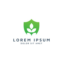 shield and leaf negative space logo design