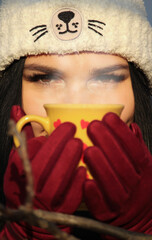 Portrait of a girl holding a cup of hot drink