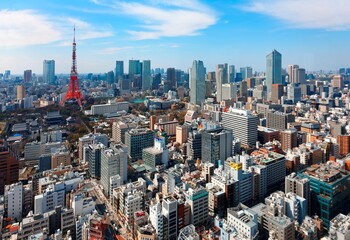 Beautiful city skyline of Downtown Tokyo, with the famous landmark Tokyo Tower standing tall among...