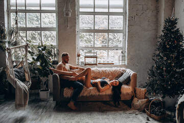 An incendiary story of a couple in love in the New Year. The guy and the girl spend time together. New Year's love story in a cozy home environment.
