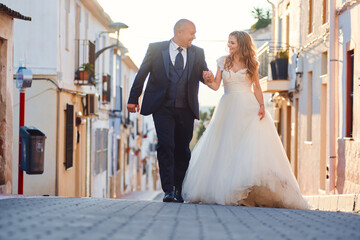 Newlyweds walk the streets of the old city