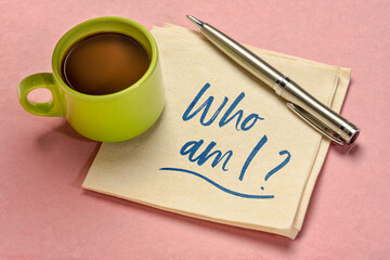 Who am I? A philosophical question  on a napkin with coffee. Personal development, life purpose, identity, lifestyle and career concept.