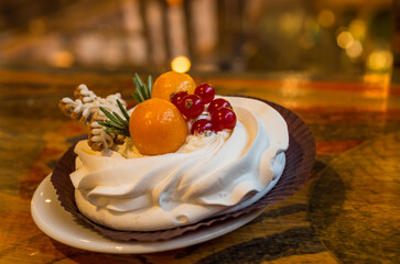 Christmas delicious cakes decorated with a gingerbread snowflake, cranberries, physalis.